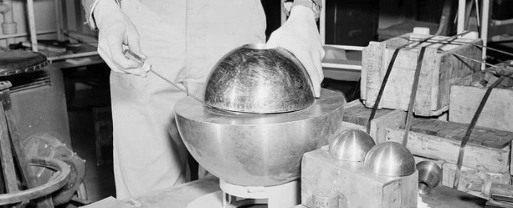 A uranium core known as the demon core being handled in a laboratory